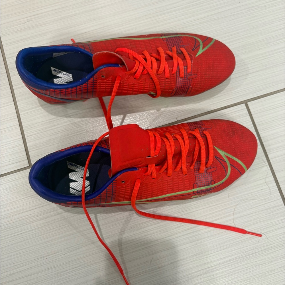 Nike red/orange cleats